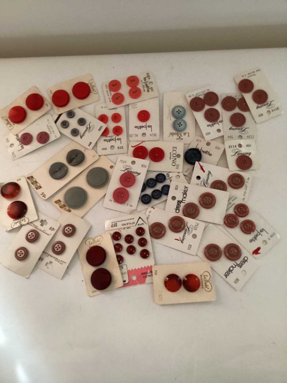 Vintage lot of buttons on original cards. Red, brown and grey